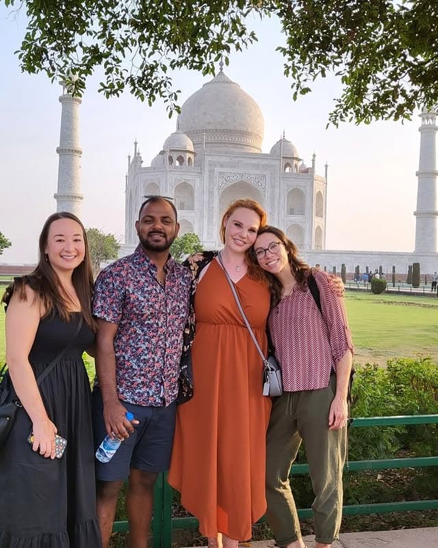 Group of four happy travellers at the Taj Mahal — Taj International Tours