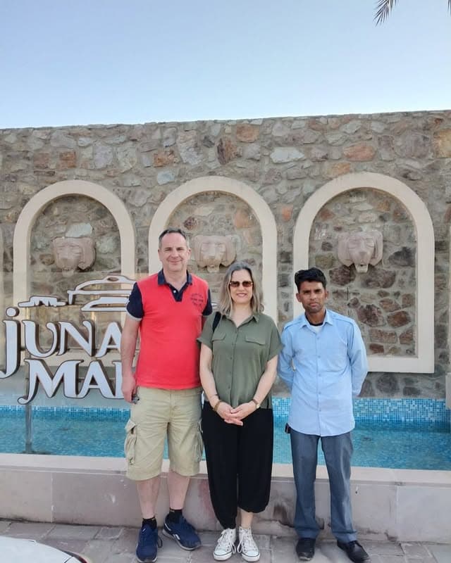 Couple with local guide at Rajasthan heritage site — Taj International Tours
